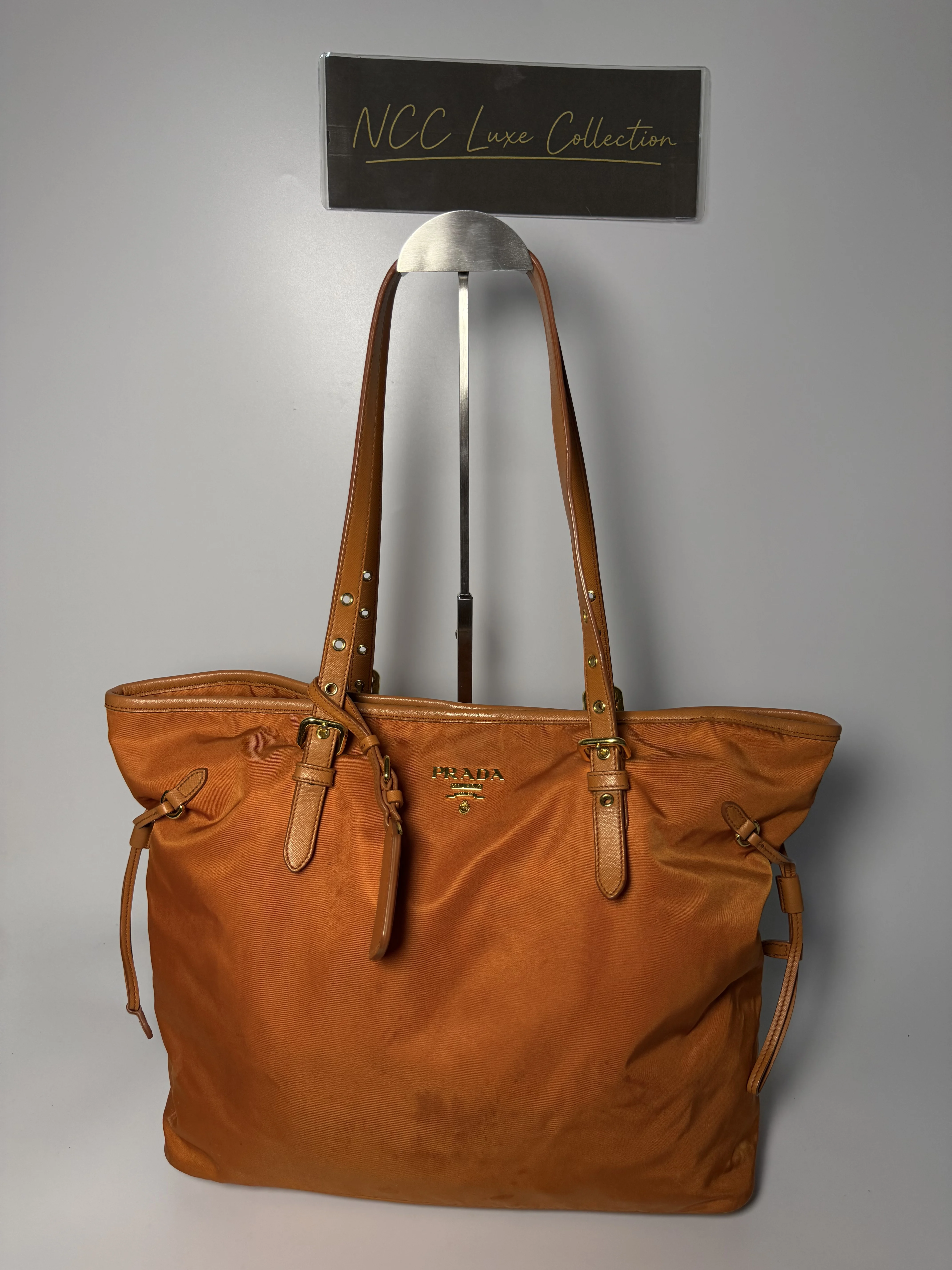 Prada Tessuto tote bag in orange nylon with Saffiano leather trim and gold-toned hardware.
